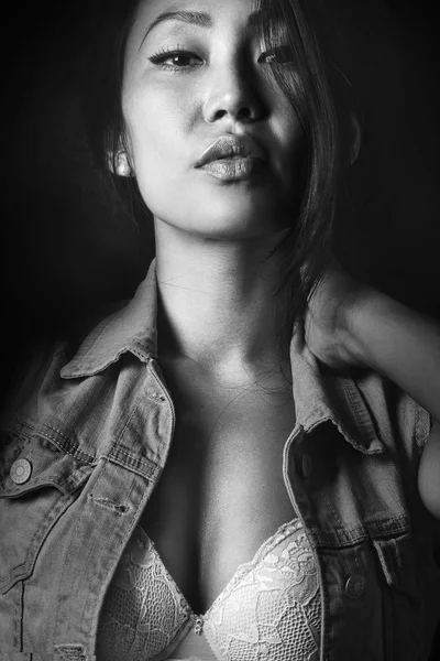 Portrait of the sensual girl in jeans jacket on the black background — Stock Photo, Image