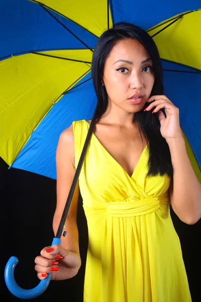 Charming woman in yellow dress with a stylish umbrella — Stock Photo, Image