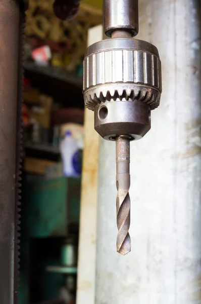 Drill bit in drill head Royalty Free Stock Images