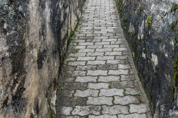 Ancient stone path with walls. Switzerland. Historic and abstract.