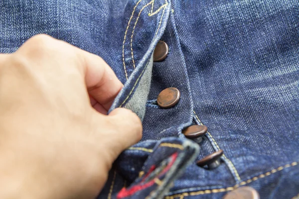 Kot pantolon düğmesini açmak — Stok fotoğraf