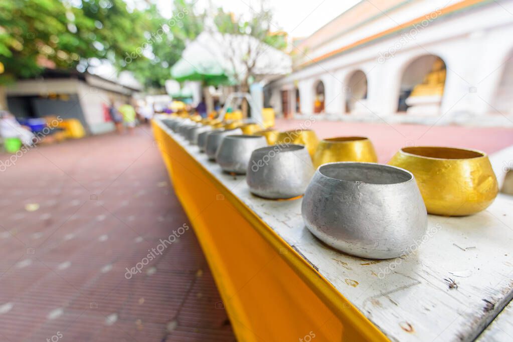 Nakhonpathom, Thailand - 31 October, 2020: gold and silver Monk's bowl  in Praying Homang to Phrapathom Chedi event