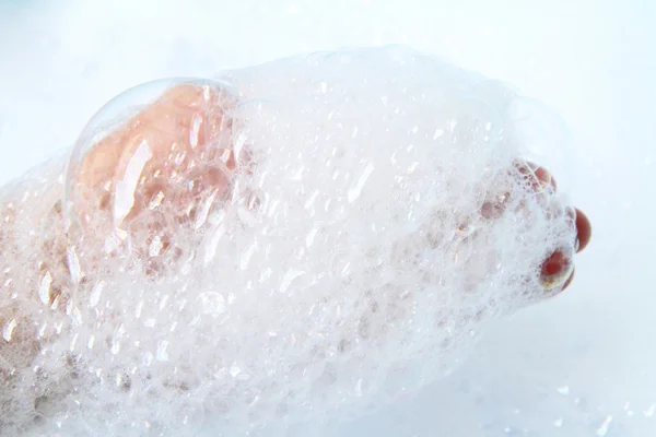 Bubble foam in hand — Stock Photo, Image