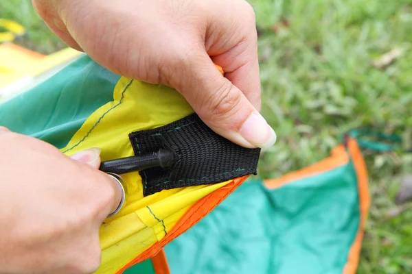 Push the tent pole to socket of tent — Stock Photo, Image