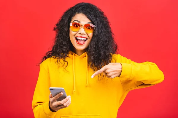 Happy Young African American Woman Casually Dressed Standing Isolated Red Royalty Free Stock Photos