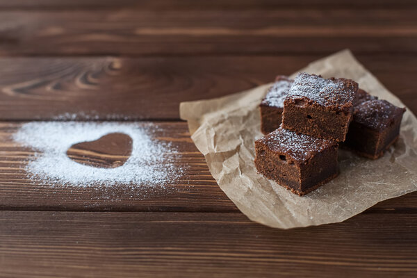 Chocolate brownie with powdered sugar heart
