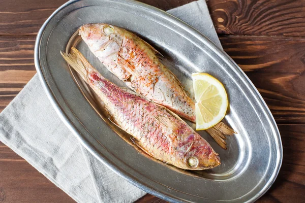 Fried red mullet on the oval dish — Stock Photo, Image