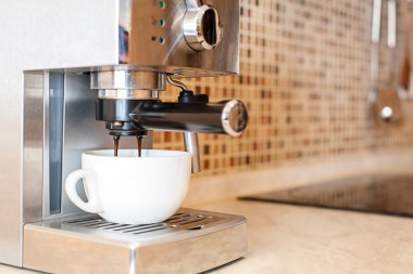 Coffee machine making espresso in a cafe clipart