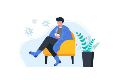 Sıcak giysili hasta adam limonlu sıcak çay içiyor..