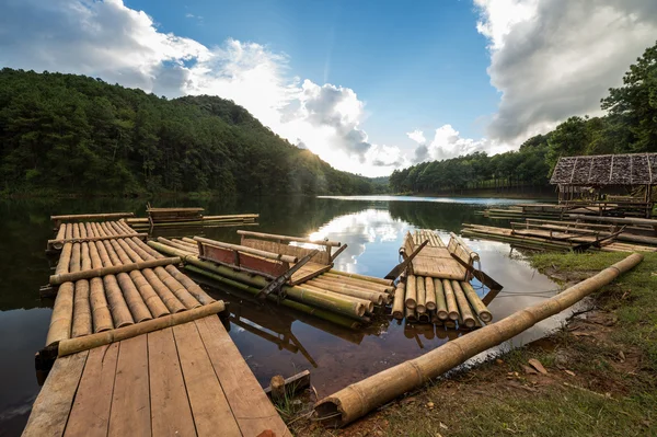 Wooden raft with the sun — Stock Photo, Image