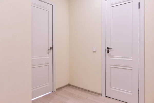 hallway of the apartment. Entrance door and toilet door. Concept of real estate objects