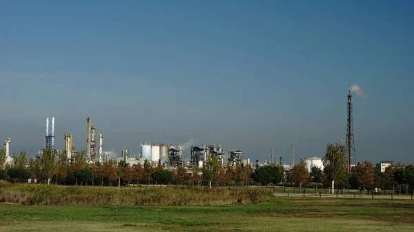 green area with background chemical industry