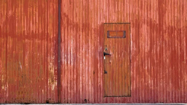 red rusty industrial metal door background