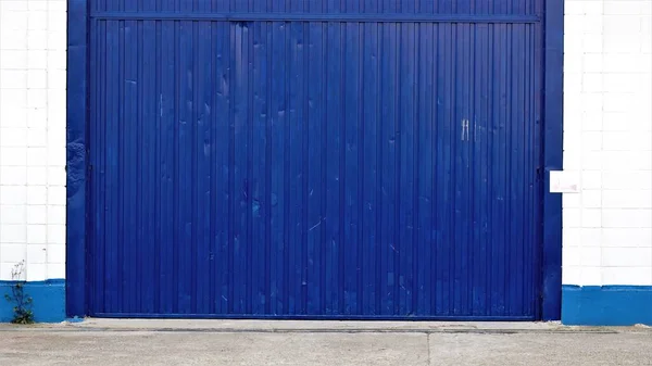 warehouse metal industrial blue door entrance