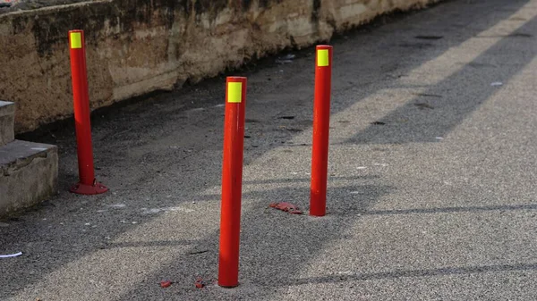 red security pylons on the street