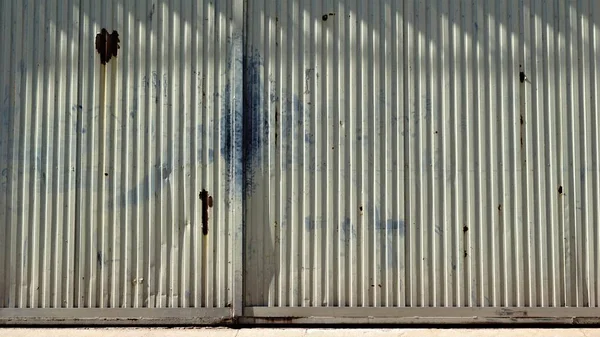 worn factory metal door background