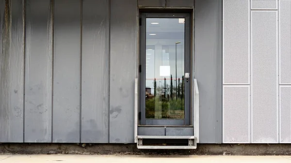 glass exit door on modern facade