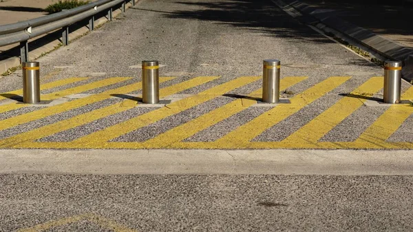 metallic pylon security barrier on the street