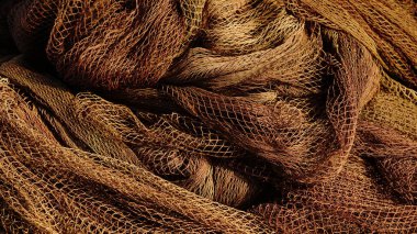 Karmaşık balık ağı dokularının üzerinde sıcak ışık