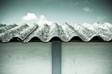 Dangerous asbestos roof  clipart