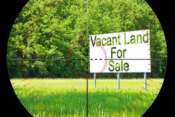 Focus on advertising billboard immersed in a rural scene with Vacant Land for Sale written on it - concept image