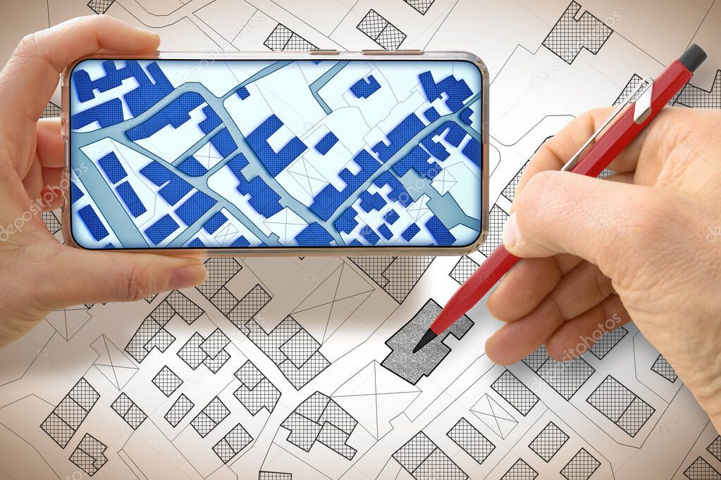 Hand drawing an imaginary cadastral map of territory with buildings and land parcel - concept with smarphone.