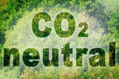 CO2 Neutral text - concept image against a forest backgound. clipart