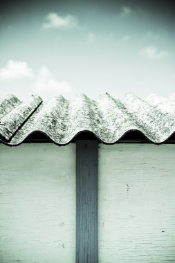 Detail of a dangerous asbestos roof clipart