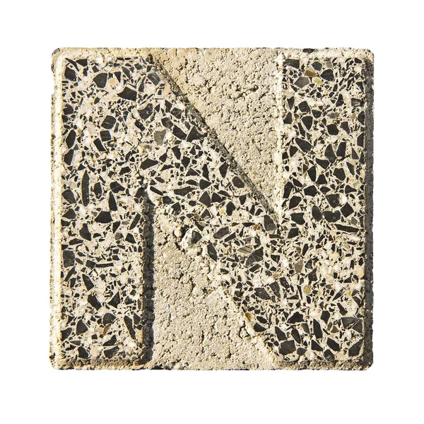 Letter N carved in a concrete block