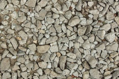 Bir yerde kum için arka plan, küçük taşlarla Tasarla