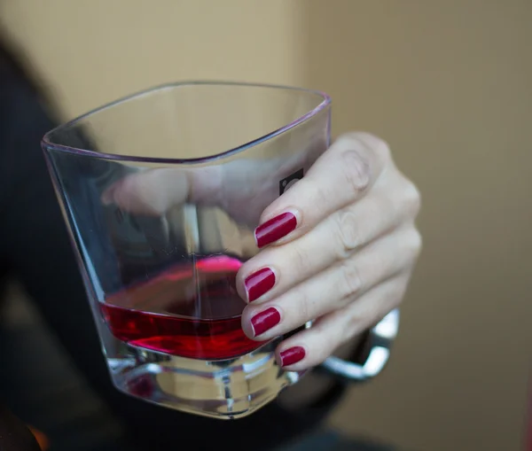 Holding red drink — Stock Photo, Image