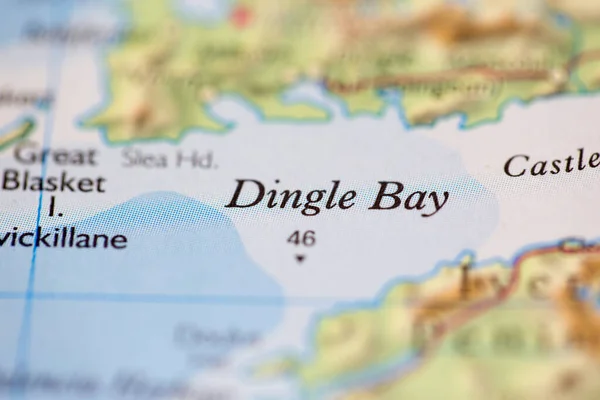 Shallow depth of field focus on geographical map location of Dingle Bay off coast of Ireland on atlas