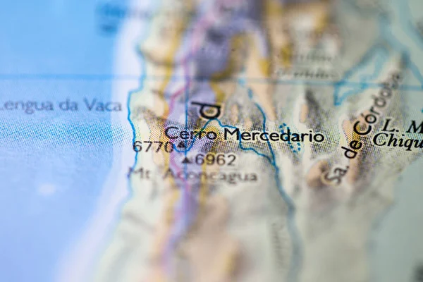 Shallow depth of field focus on geographical map location of Mount Cerro Mercedario in Argentina South America continent on atlas