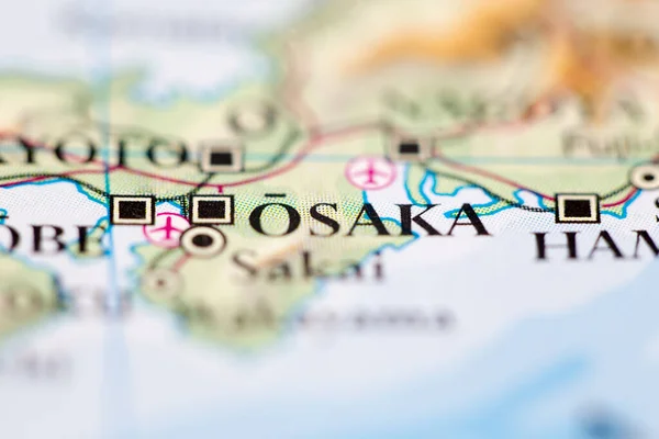 Shallow depth of field focus on geographical map location of Osaka Japan Asia continent on atlas
