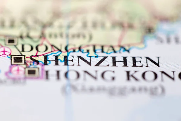 Shallow depth of field focus on geographical map location of Shenzhen China Asia continent on atlas