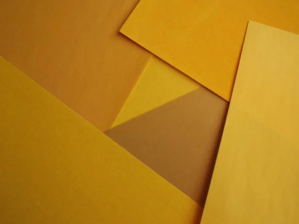 O fundo do cartão é feito de diferentes tons de amarelo Imagem De Stock