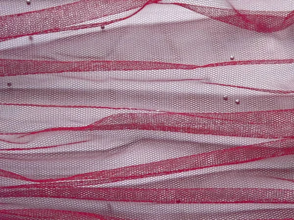 Fond en tissu rouge translucide sur fond blanc — Photo