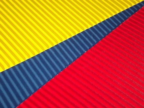 Amarillo azul ROJO acanalado fondo corrugado con diagonal STRIPE — Foto de Stock