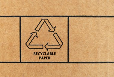 Geri dönüşümlü karton üzerine basılmış geri dönüşümlü kağıt işareti. Kapat..