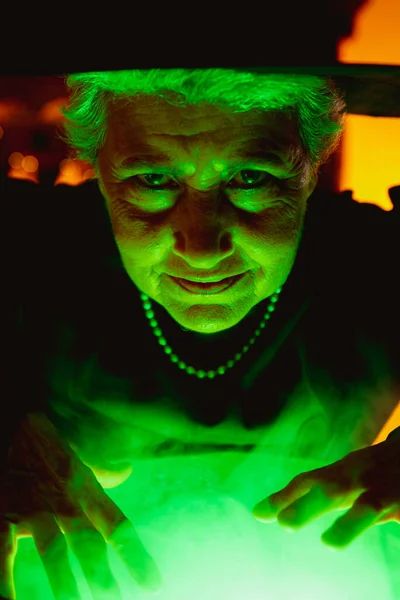 Old Witch Looking Camera Illuminated Green Light Her Magic Potion — Stock Photo, Image