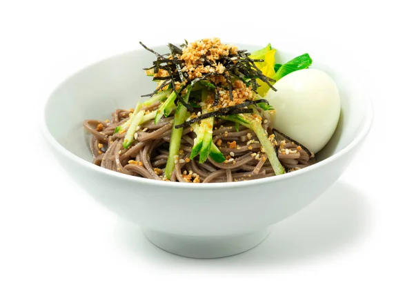 Makguksu Buckwheat Soba  Noodles Sesame Sauce ontop cucumber cutlet and seaweed sprinkle sesame served Boiled egg Korean Food Style sideview