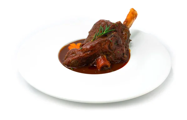 Braised Lamb Shank with Red Wine Sauce and vegetables until tender and shreddable European Food Style sideview