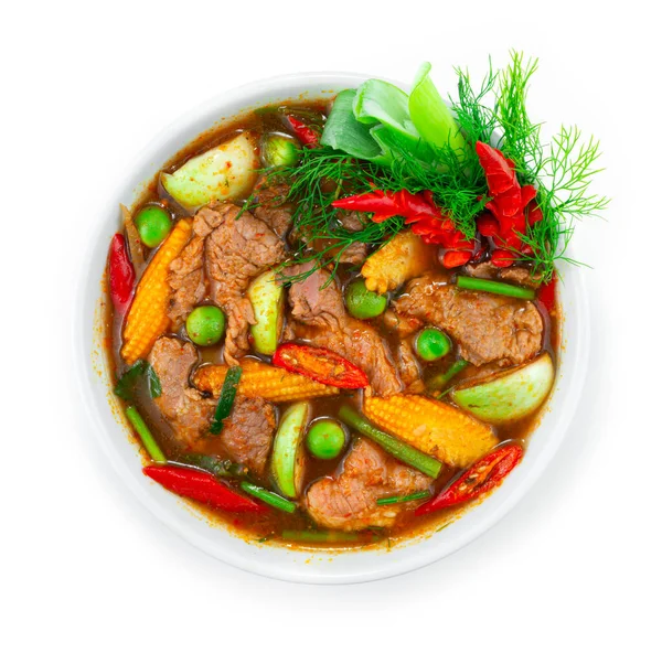 Beef Spicy Red Curry Spring Soup with Herbs Thai Food Local Style decorate with carving chili and vegetables topview