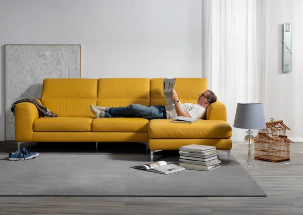 Single shot photo of a room with a sofa and person