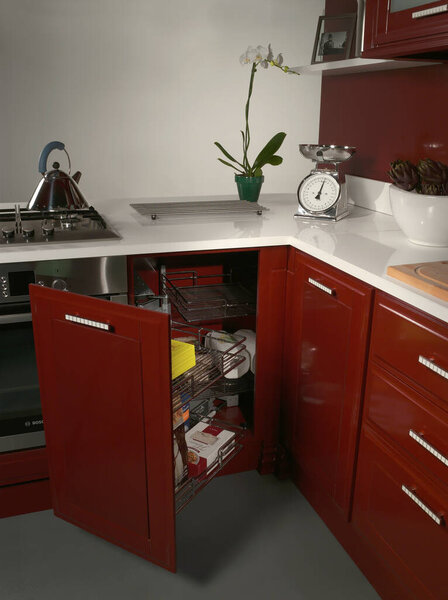 Basket for food and objects on a kitchen cabinet 