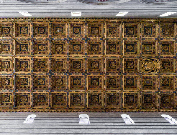 Texture of an ancient coffered ceiling made of inlaid wood 