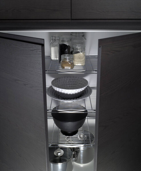 Close up of the inside of a pantry cabinet in a kitchen