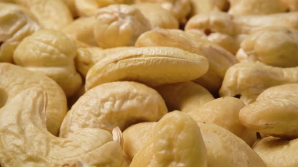 Heap of cashew nuts macro slow panorama — Stock Video
