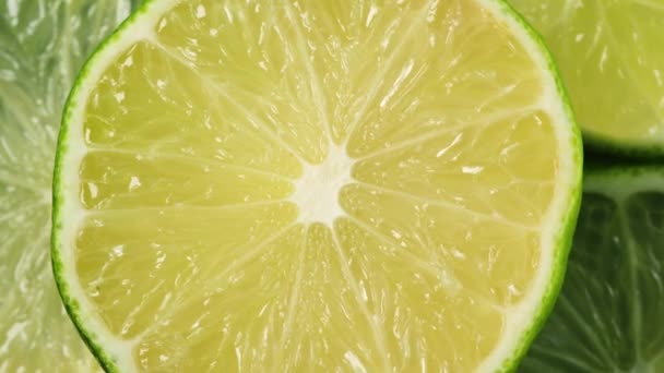 Fette di lime. Frutta sfondo. Calce verde a fette rotanti — Video Stock