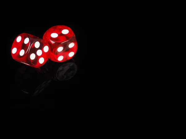 Two red casino dices with  reflection . black background — Stock Photo, Image